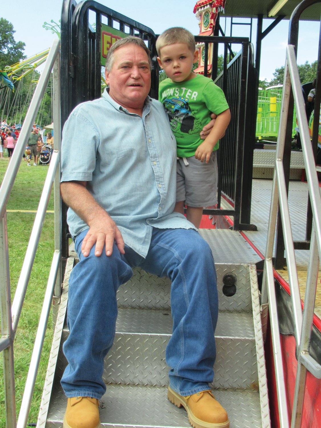 GRAMP’S GUY: Johnston resident Dennis Cardillo brought his grandson to the festival so he could enjoy the many offerings for kids.